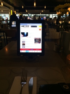 Ordering dinner off an iPad at Mimosa in MSP Terminal G. (Katherine Hart, 2014)